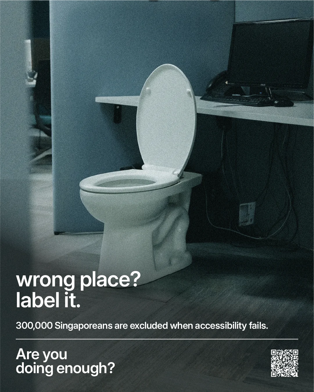 Campaign poster showing a toilet installed beside an office desk, headlined: wrong place? label it.